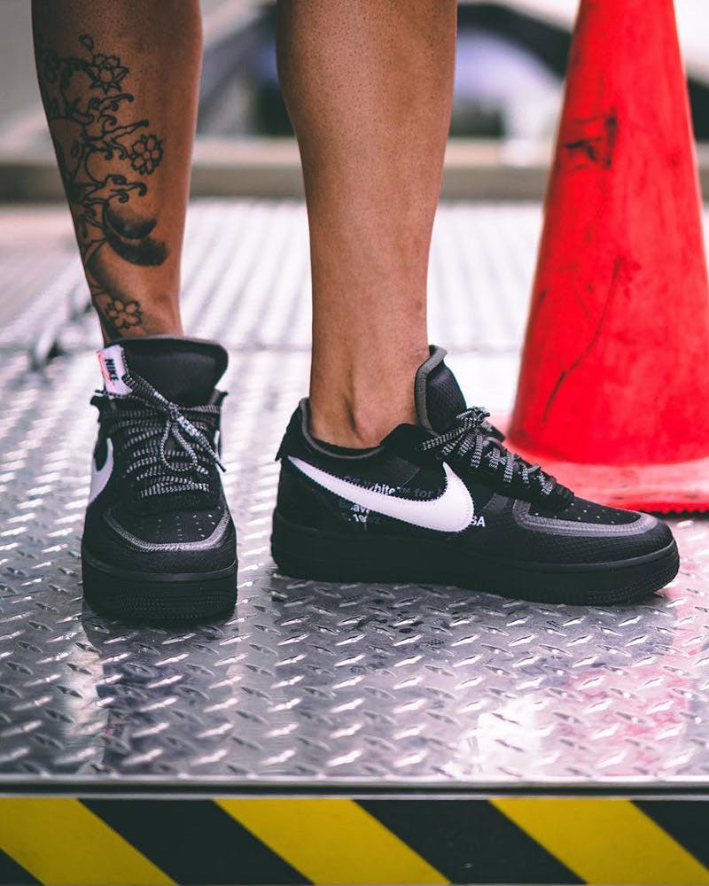 white and black air force 1 on feet